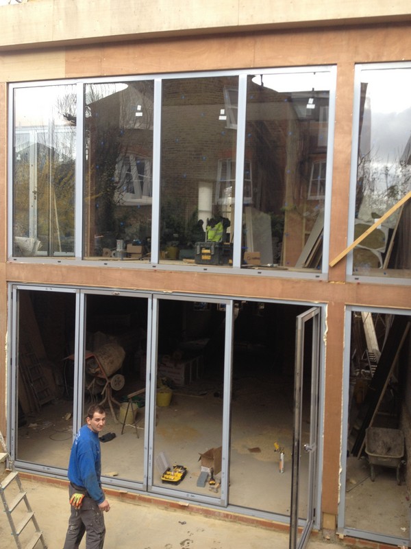 Aluminium bi-fold doors with two-storey glazing in Hackney