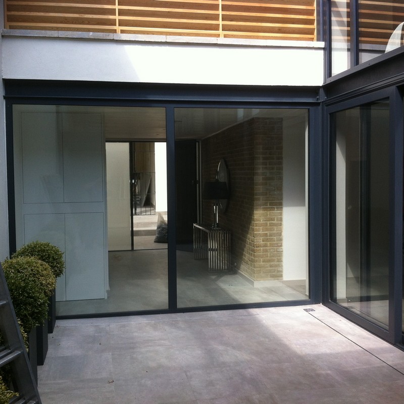 Floor-to-ceiling sliding doors opening to courtyard in Hackney