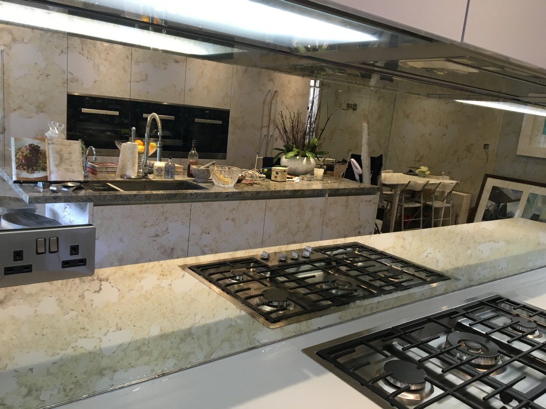 Mirror glass splashback in Hackney luxury kitchen