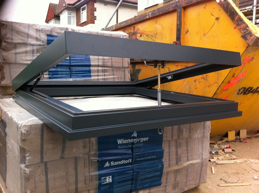 Opening flat roof skylight in anthracite grey installed in Hackney
